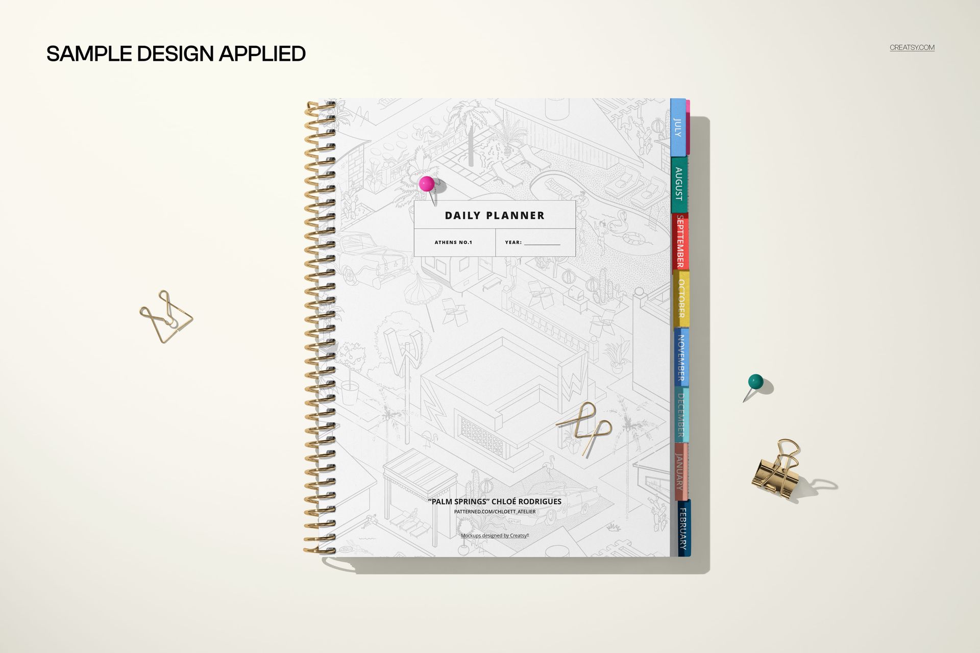 Tabbed planner mockup displayed in a top-down perspective, featuring colorful tabs and minimal desk accessories nearby.