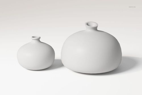 Front view of two round bellied ceramic vases in matte white, displayed on a plain light background.