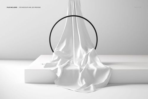 Silk scarf mockup featuring a flowing white fabric displayed on a white platform with a black ring accent.