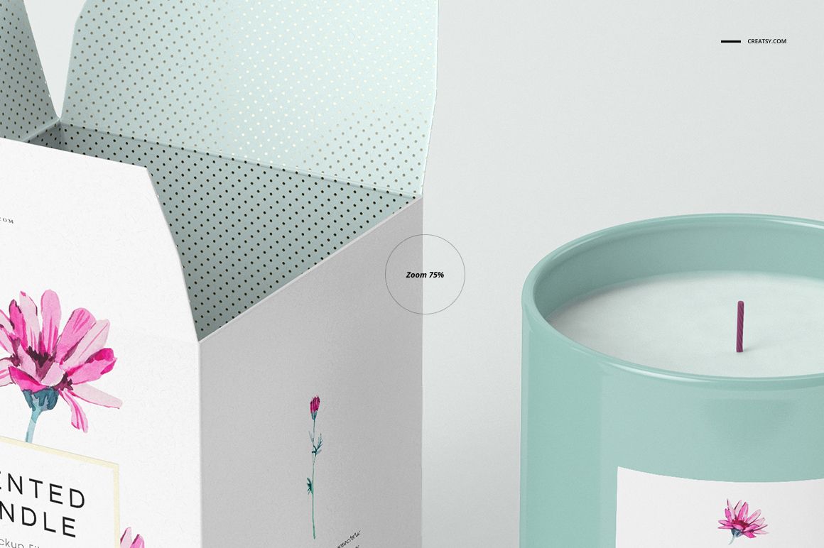Close-up of a candle mockup featuring a pastel blue jar and an open white box with pink flower illustrations and dotted interior.