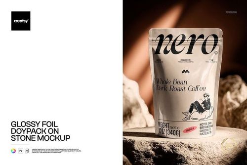 Coffee doypack mockup with shiny foil finish placed on a stone background, showing front design details.