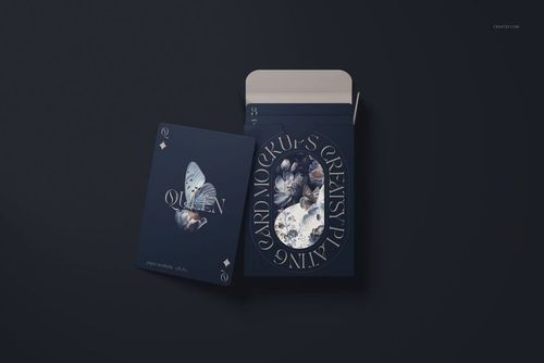 Playing cards mockup featuring a dark blue card box and a single card with butterfly artwork, viewed from above.