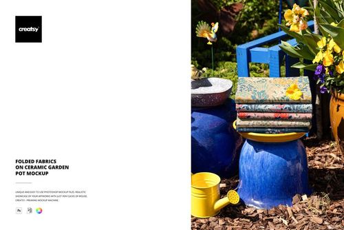 PSD mockup showing stacked fabrics on a vibrant blue garden pot, with yellow flowers and gardening tools nearby.