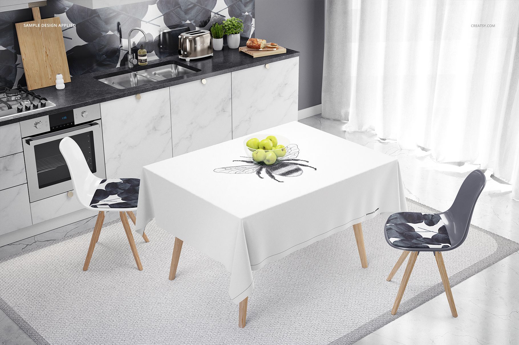 Kitchen interior with a marble countertop, white tablecloth mockup displaying a bee design, and patterned chairs.