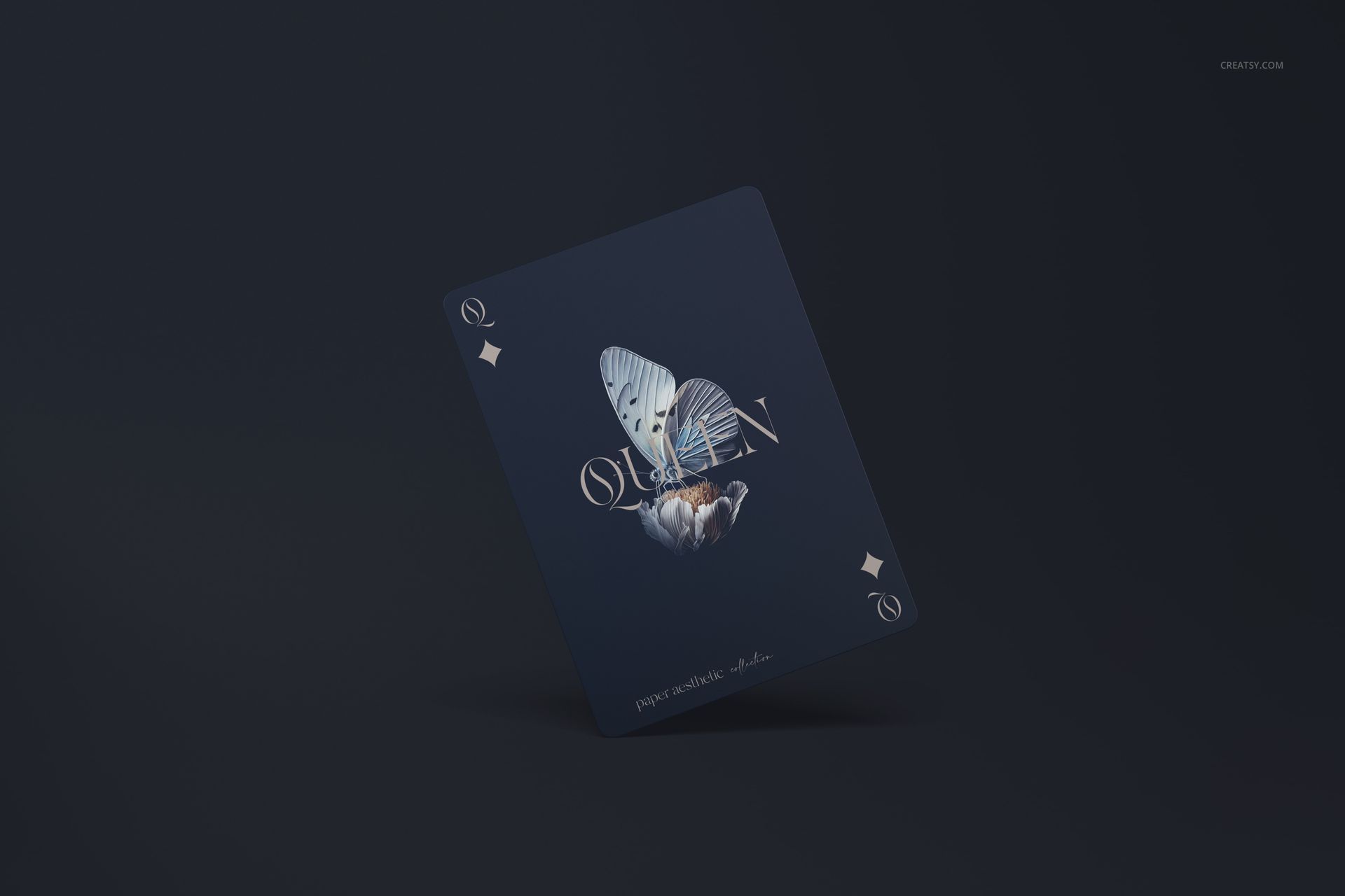 Single playing card mockup featuring a dark blue background, butterfly illustration, and diamond suit, angled view.