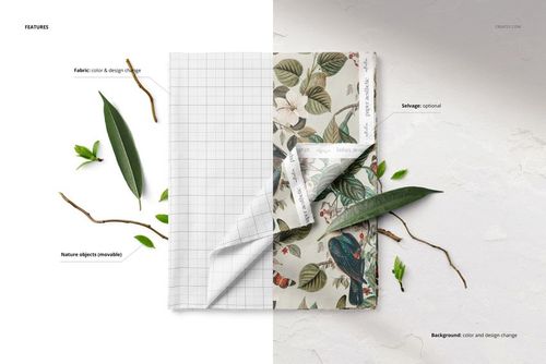 Folded fabric mockup displayed from a top view, featuring a botanical pattern and grid design with scattered leaves and twigs.