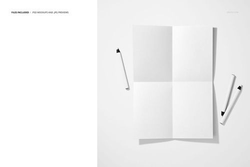 Folded blank poster mockup displayed on a white surface with three crayons scattered nearby, top view.