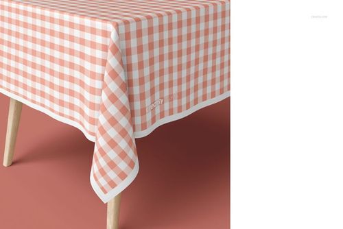Tablecloth mockup featuring a pink and white gingham design on a table, shown from a close-up angled perspective.