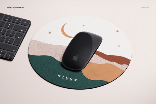 Round mouse pad mockup featuring a wavy pattern and crescent moon, placed beside a black computer mouse and keyboard.