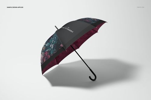 Umbrella mockup featuring a mix of burgundy and black sections with floral designs, angled on a neutral background.
