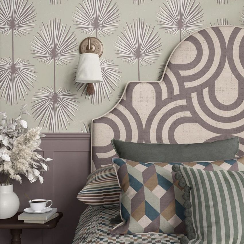 Bedroom pillow mockup featuring patterned pillows, a geometric headboard, and wallpaper with abstract botanical designs.