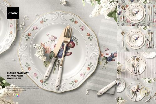 Top view of a mockup set featuring a floral plate, striped napkin, gold cutlery, and delicate white flowers.