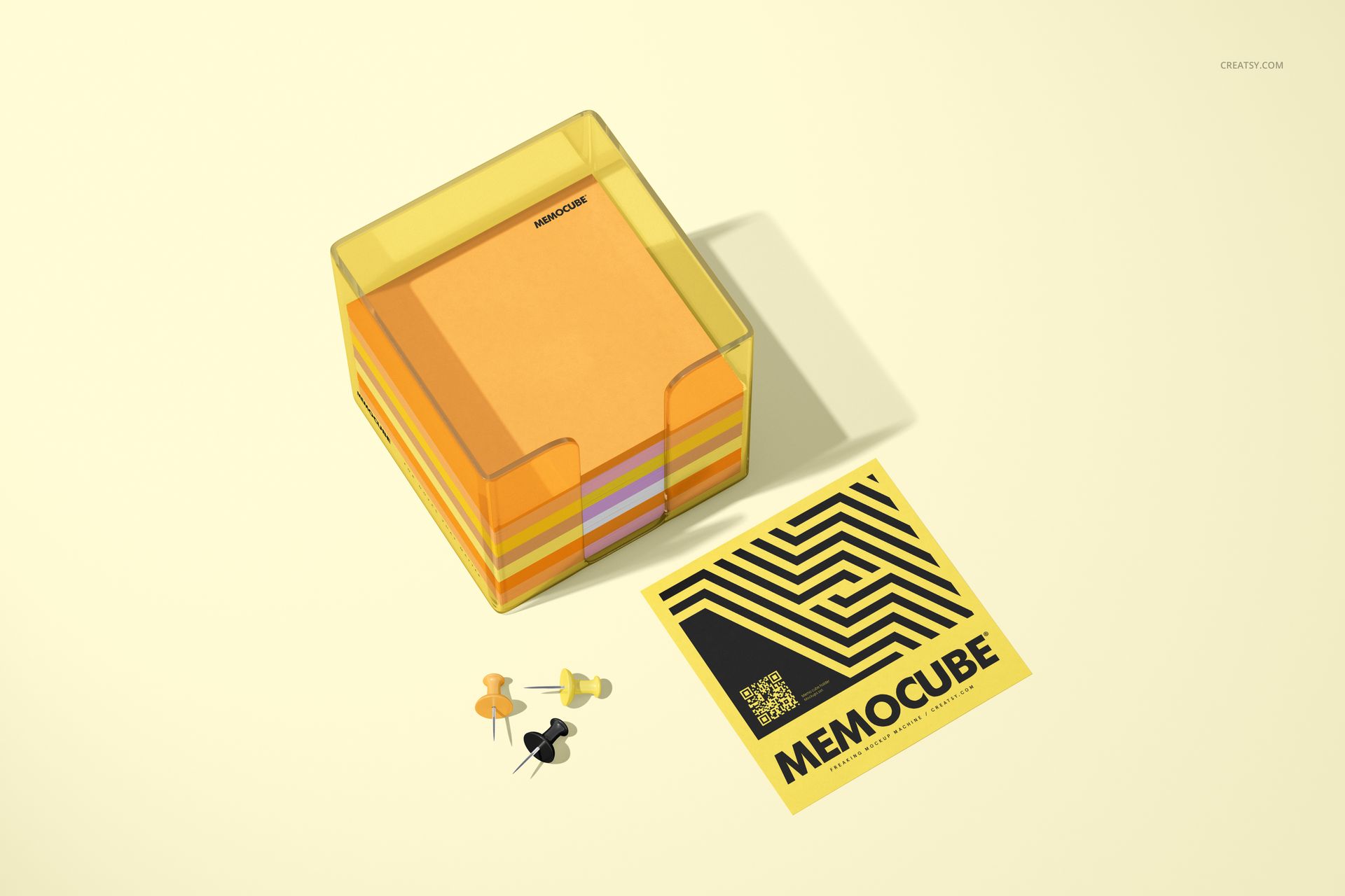 PSD mockup of memo block cube in acrylic holder, featuring colored paper sheets, push pins, and a yellow printed card.