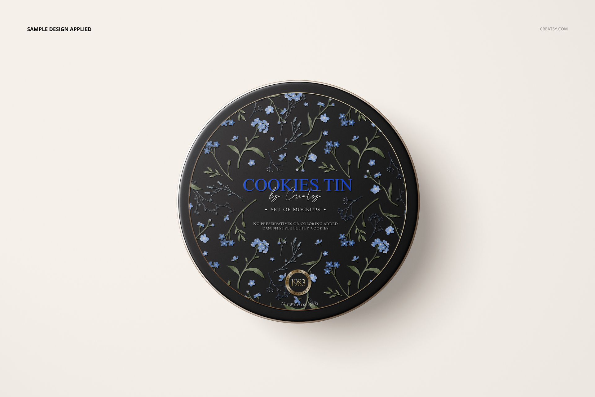 PSD mockup of a circular cookie tin featuring a black surface with delicate blue and green floral design, top perspective.