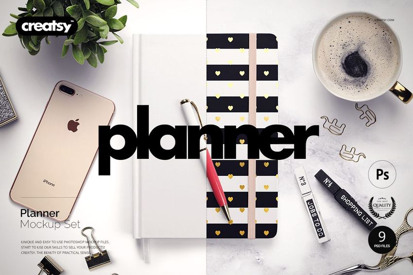 Top view of a planner mockup set with a black and white heart pattern cover, pen, coffee cup, smartphone, and stationery items.