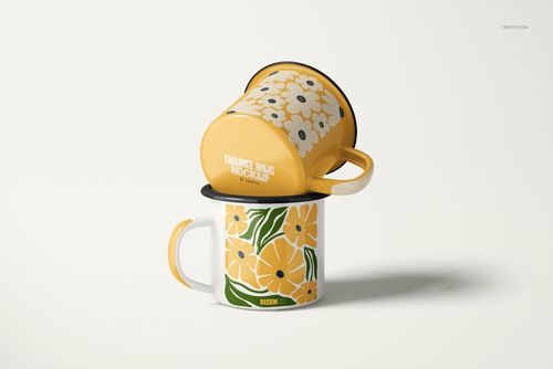 PSD mockup of enamel mugs with bold yellow and green floral artwork, arranged with one mug inverted on top.