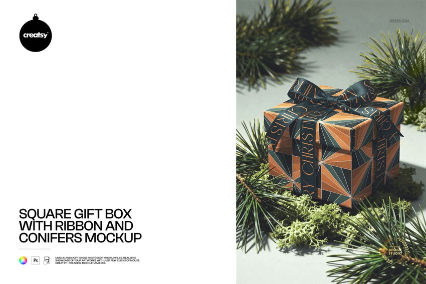 Square gift box with a geometric patterned design and dark ribbon, surrounded by conifer branches, front view mockup.