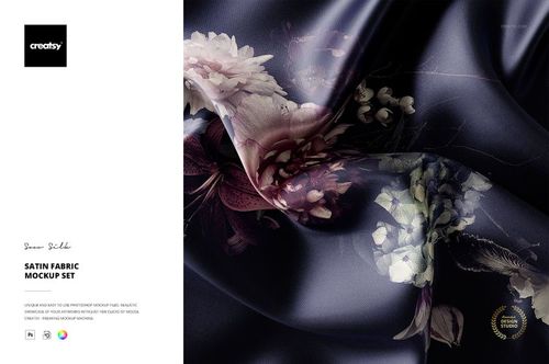 Satin fabric mockup featuring a close-up view of dark, glossy material with floral patterns and soft folds.