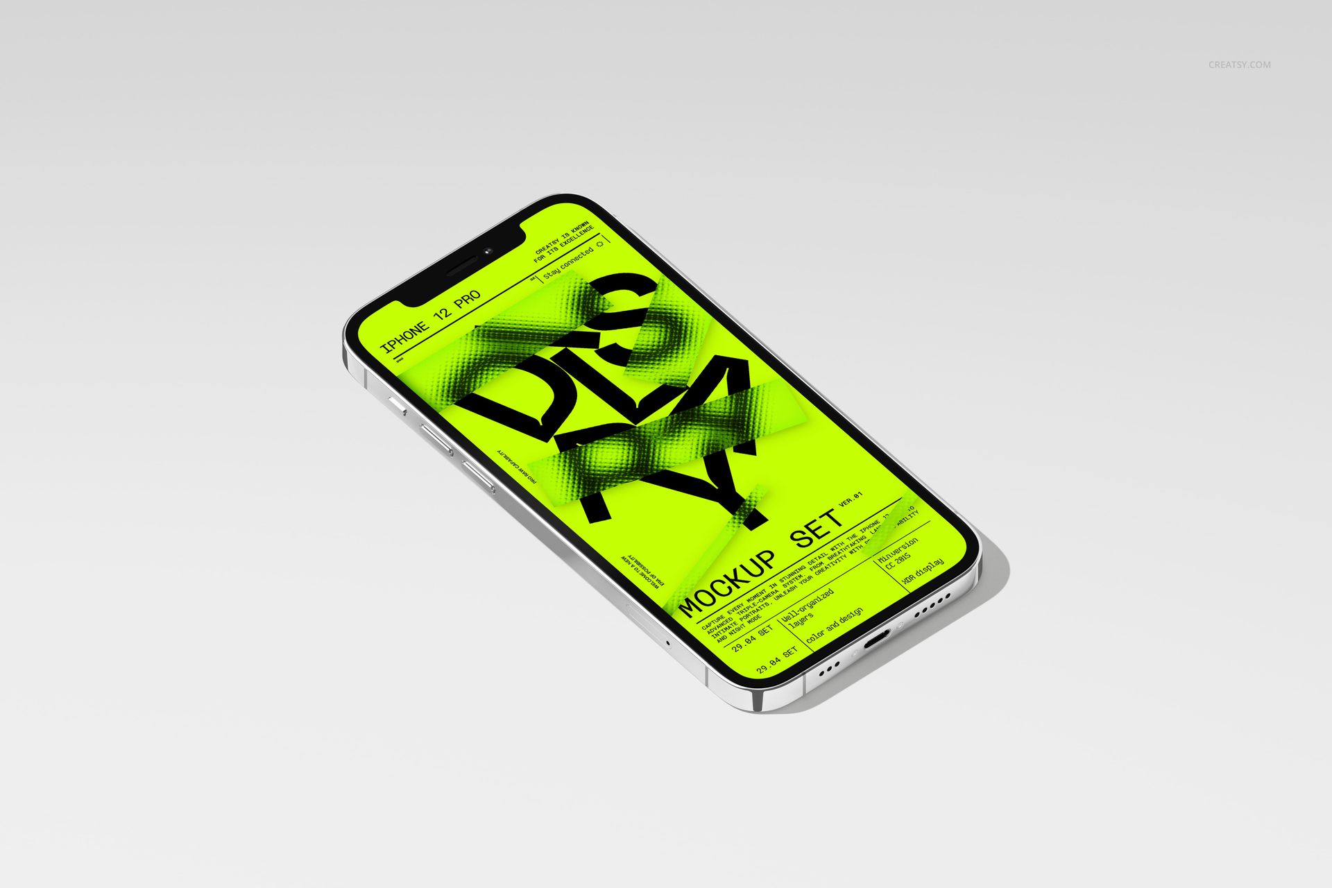 iPhone 12 Pro lying on a light surface, displaying a bright yellow graphic screen in a PSD mockup setup.