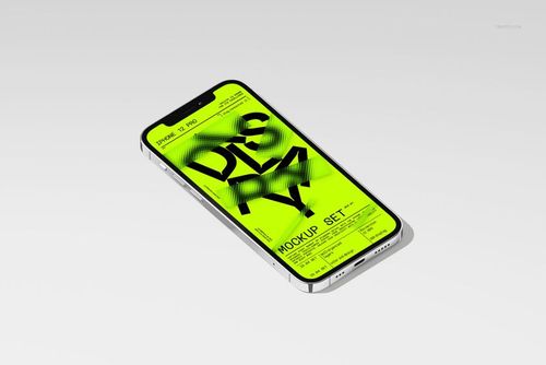 iPhone 12 Pro lying on a light surface, displaying a bright yellow graphic screen in a PSD mockup setup.