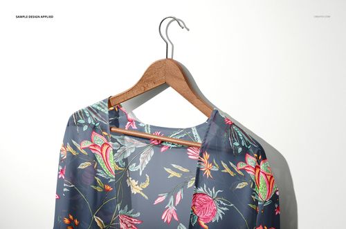Front view of a chiffon kimono mockup featuring a vibrant botanical print, displayed on a hanger against a light background.