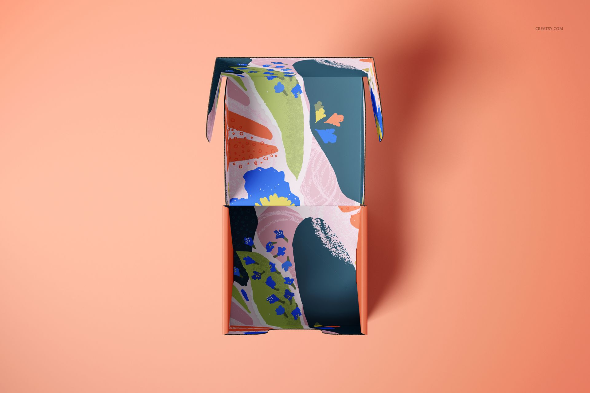 Top-down perspective of a mailer box mockup featuring vibrant abstract designs, displayed on a solid peach surface.