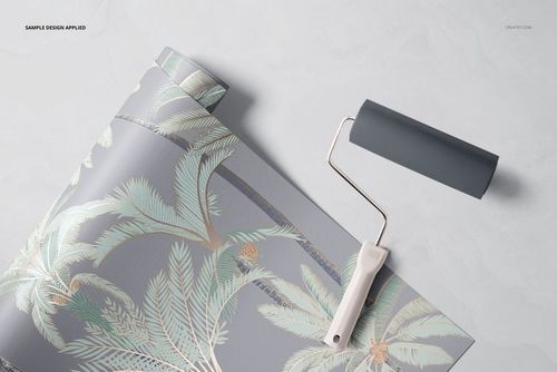 Tropical-themed paper wallpaper mockup featuring palm leaves in pastel tones, partially unrolled with a paint roller nearby.