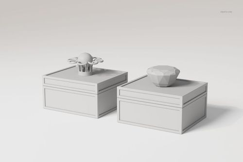 Two art deco jewelry boxes with geometric lids displayed on a plain surface, shown from a front angle.