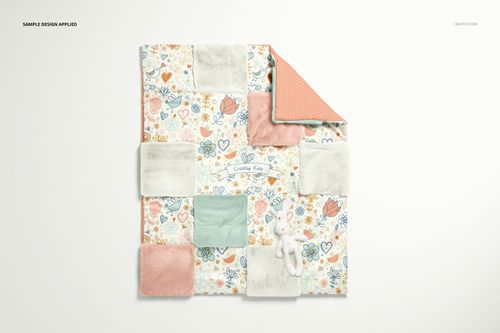 Top view of a baby patchwork quilt mockup featuring soft fleece squares, floral motifs, and a small plush toy.