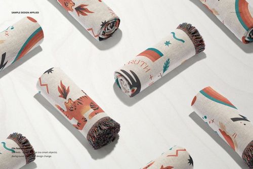 Jacquard fringed throw blankets mockup set showing several rolled blankets with playful patterns and multicolor accents.