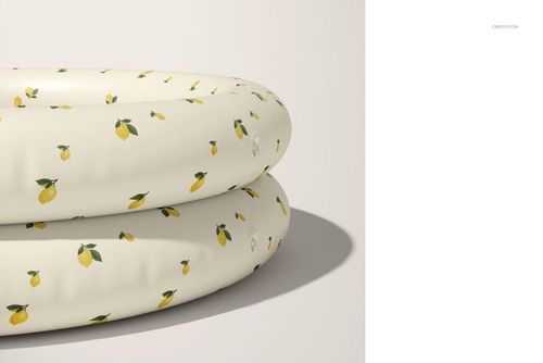Round inflatable pool for children, decorated with small yellow lemons and green leaves, displayed in a PSD mockup.