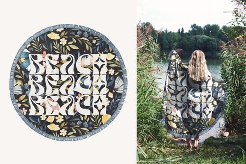 Round fringed beach towel mockup featuring botanical design in blue, yellow, and cream, shown flat and outdoors.