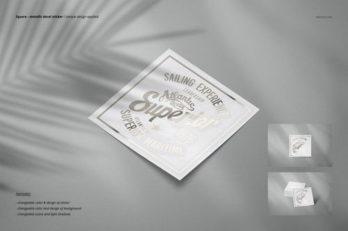 Square-shaped sticker mockup featuring a gold and white metallic print, displayed on a smooth gray background.