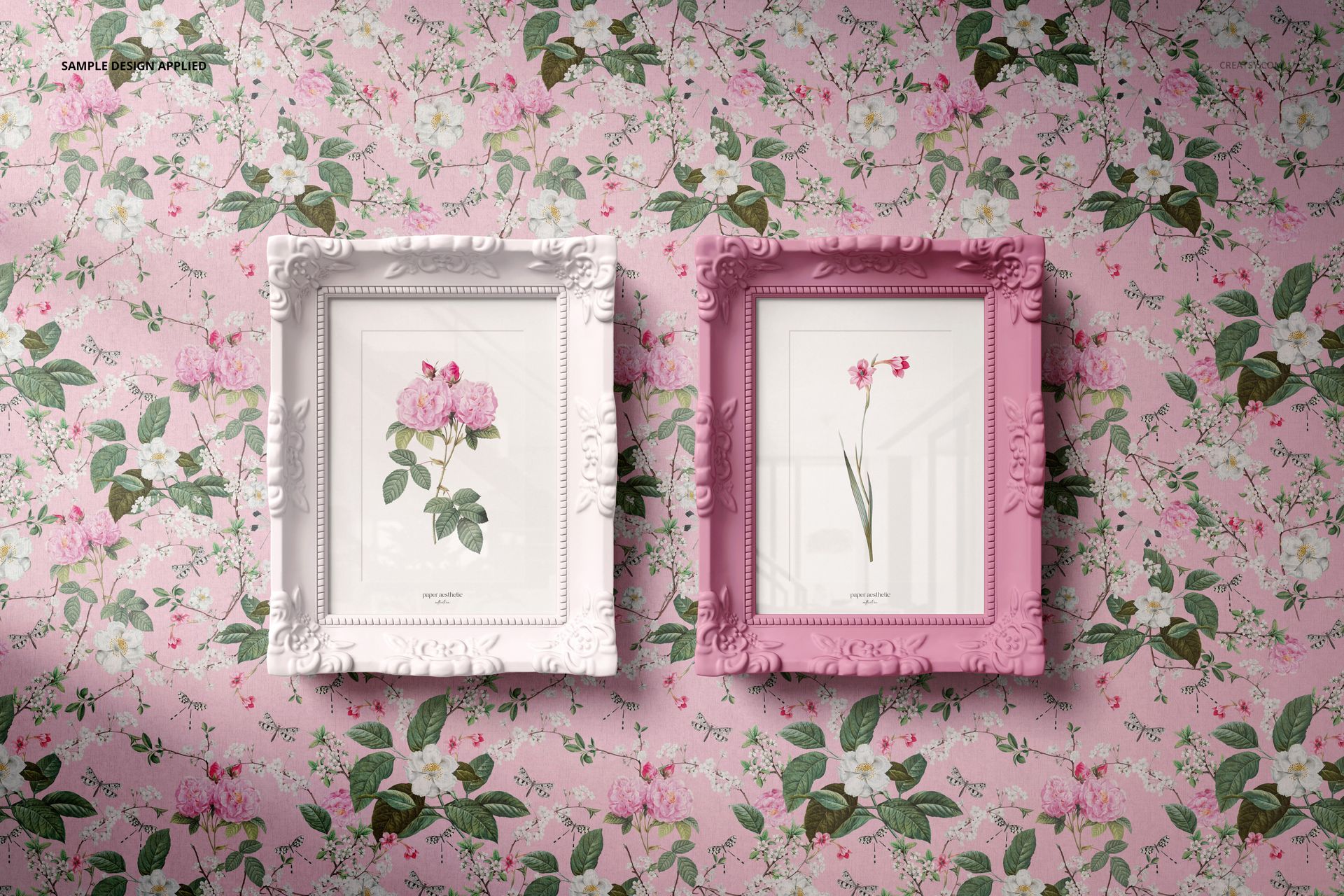 Classic painted picture frame PSD mockup featuring two decorative frames with botanical artwork on a floral wallpaper background.