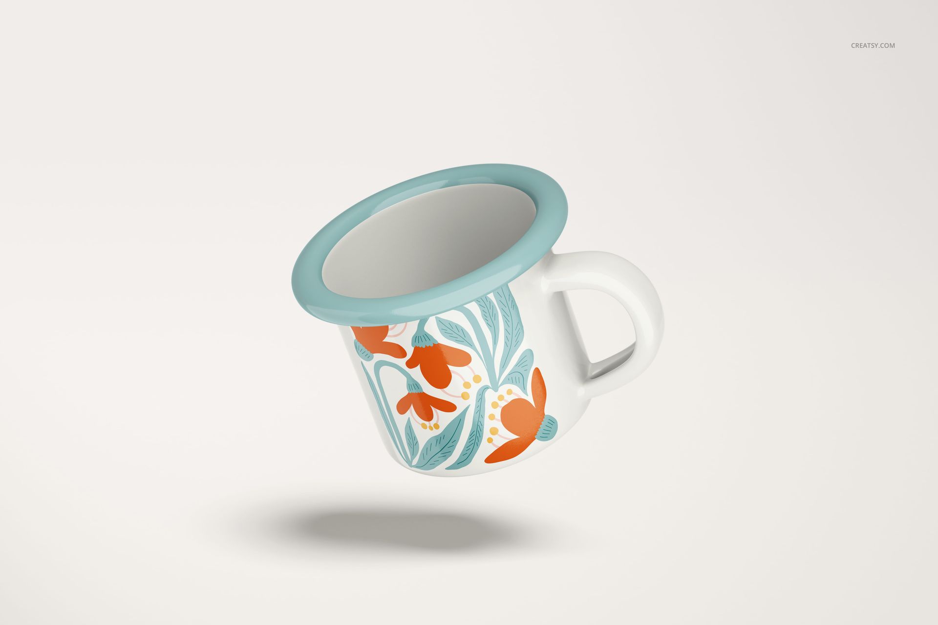 Enamel mug with a blue rim and handle, featuring orange and teal floral patterns, floating on a light background.