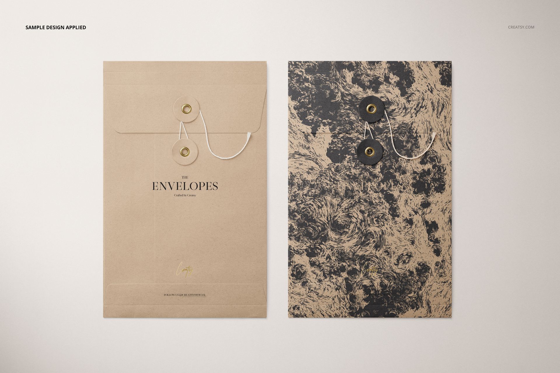 Mockup of C5 format string envelopes, one solid brown and one textured black, arranged on a light background.