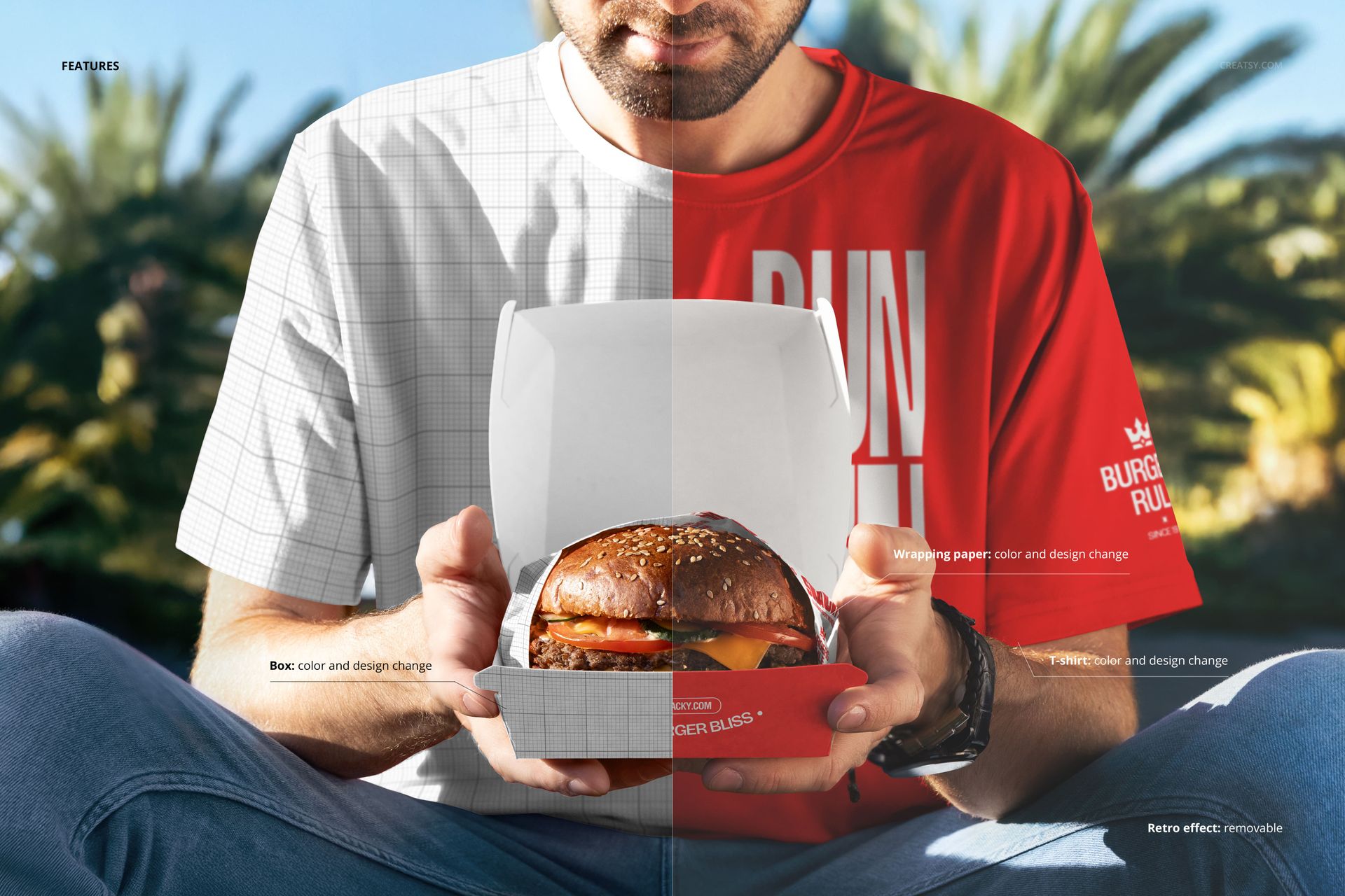 Front view of a man presenting an open burger box mockup, half in grid overlay, half in color, outdoor setting with greenery.