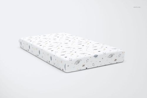 PSD mockup of a children's bed sheet with whimsical space motifs, including planets and stars, presented in a bedroom scene.