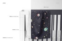 PSD mockup showing a muslin swaddle blanket with a celestial design, displayed on the rail of a white crib.