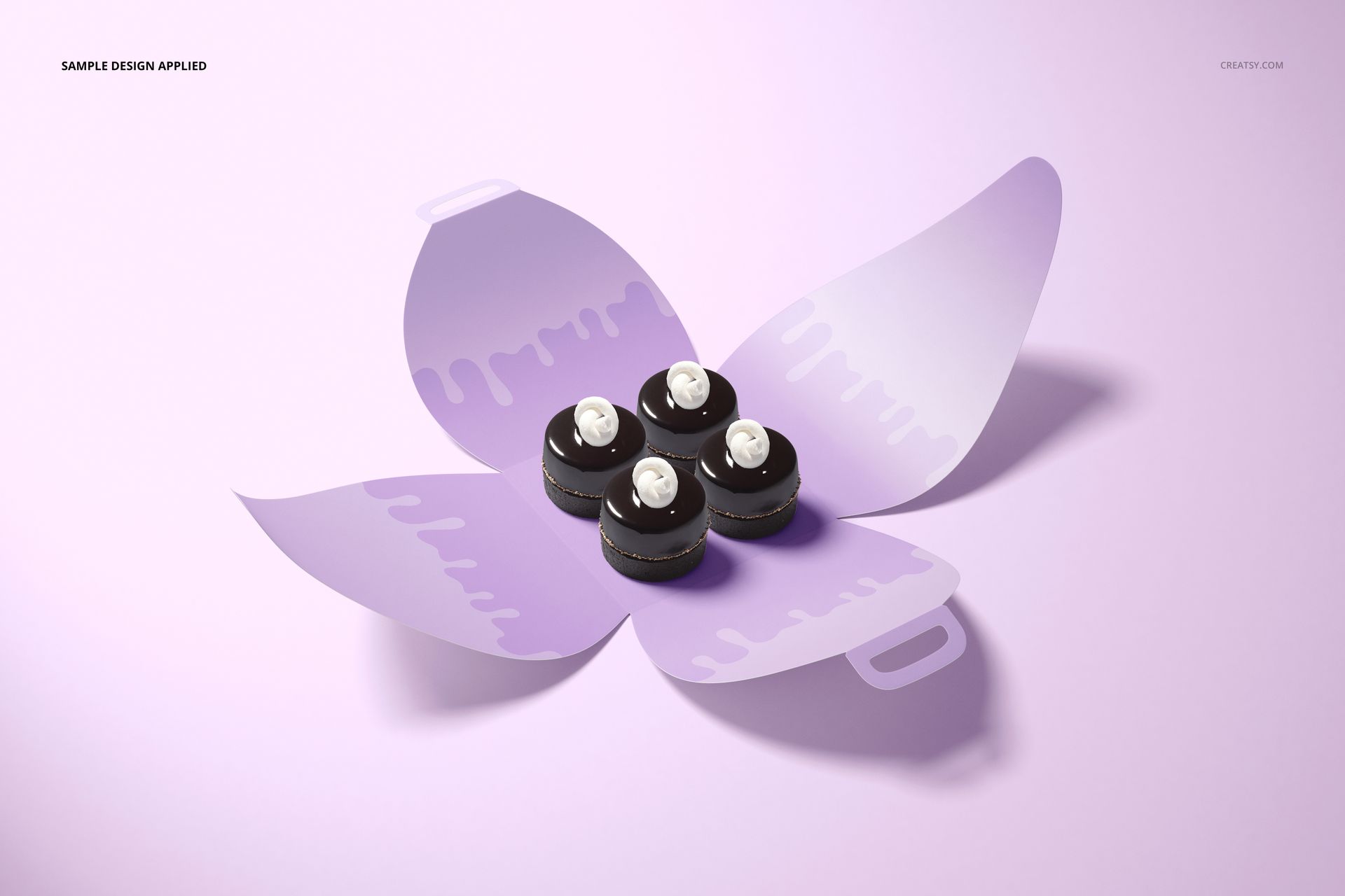Curved cake box mockup displayed open on a light purple surface, holding four chocolate cupcakes with white frosting.