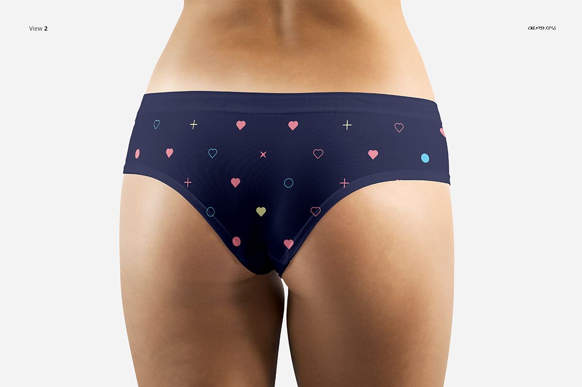 Women's briefs mockup featuring a navy blue design with multicolored hearts and geometric shapes, shown from the back.