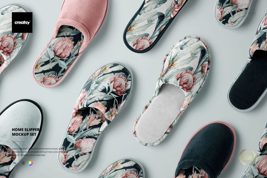 PSD mockup showing various home slippers in floral and solid styles, laid out in an organized flat lay composition.