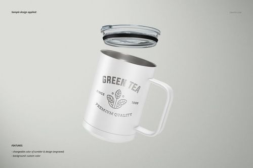 White camp coffee mug with a handle and clear lid, featuring a green tea design, floating on a light background.