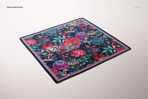 PSD mockup of a square silk scarf with colorful flower design, displayed on a neutral background at a slight angle.