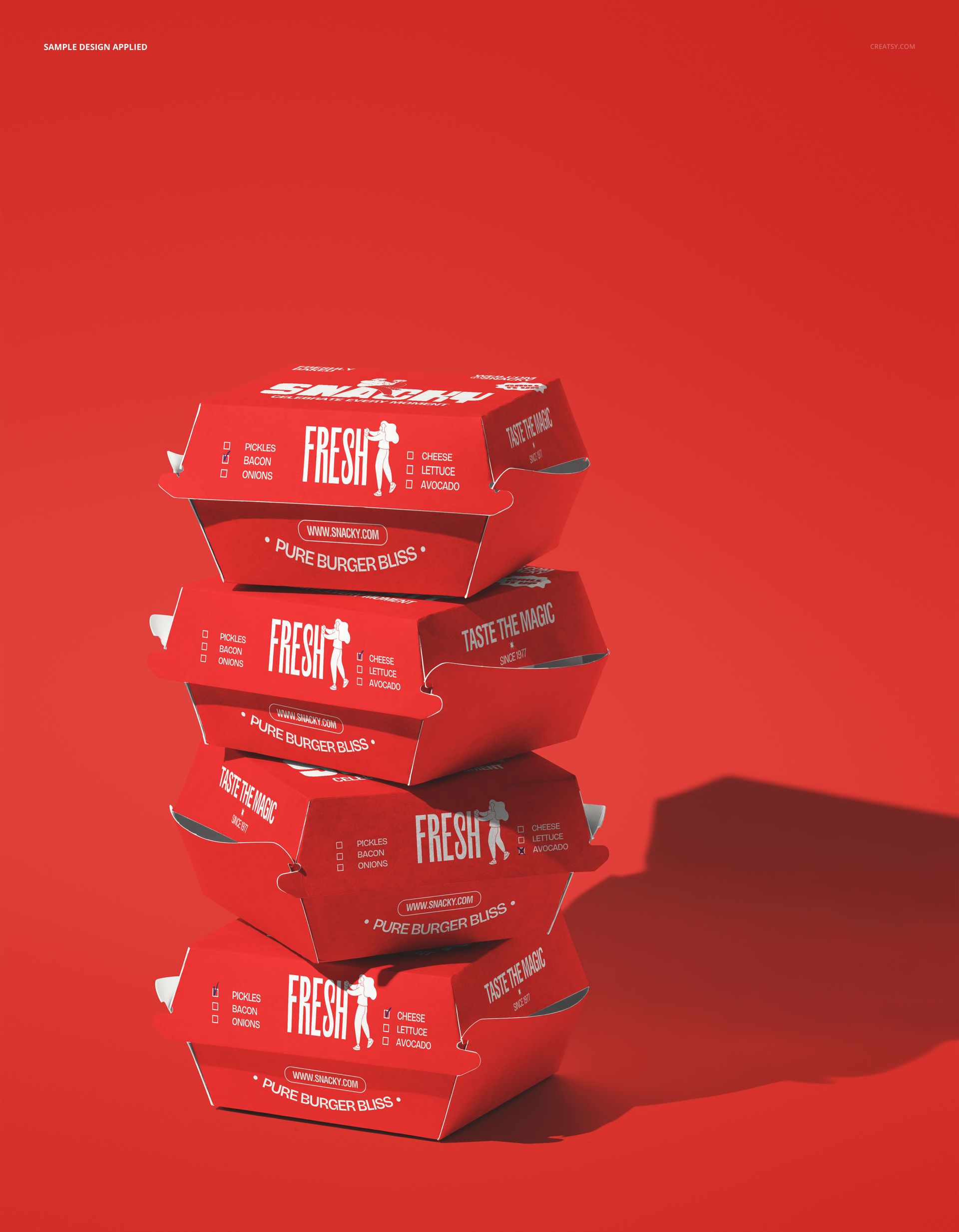 PSD mockup showing a vertical stack of red burger packaging boxes with bold white lettering on a red surface.