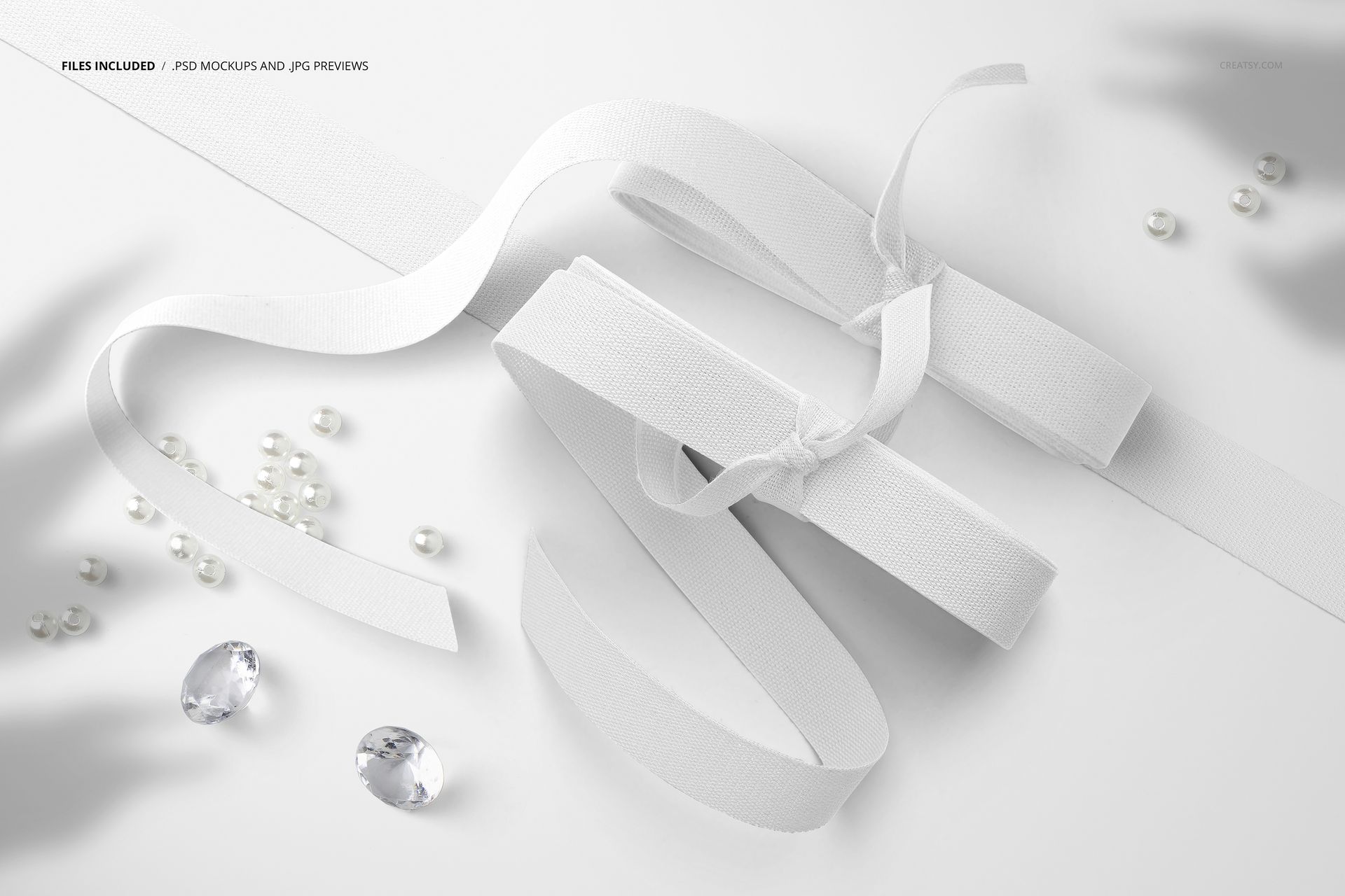 Two white cotton ribbons and assorted beads displayed on a clean background, shown in a fabric mockup scene.