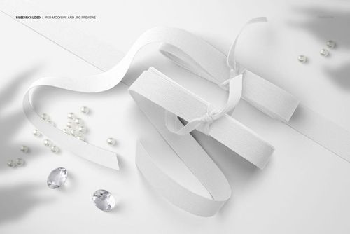 Two white cotton ribbons and assorted beads displayed on a clean background, shown in a fabric mockup scene.