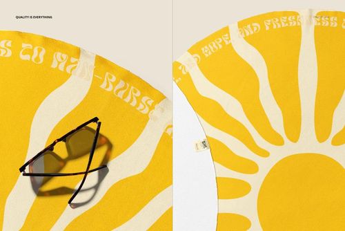 PSD mockup of a round beach towel in yellow and white, sun motif visible, with sunglasses placed on the edge.