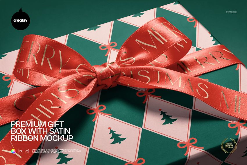 Premium gift box mockup shown from above, decorated with a festive red ribbon and holiday-themed patterned wrapping.