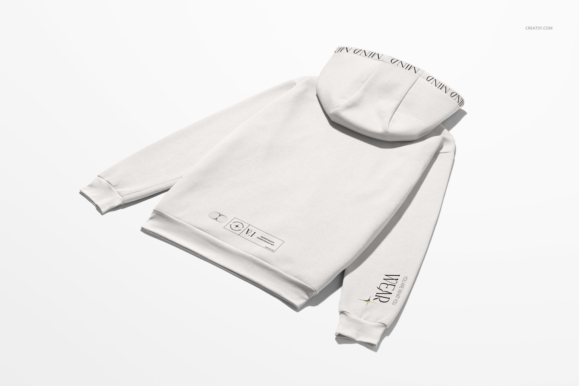 Back view of an oversized hoodie mockup in light color, displaying minimalist graphics on the lower back and hood.